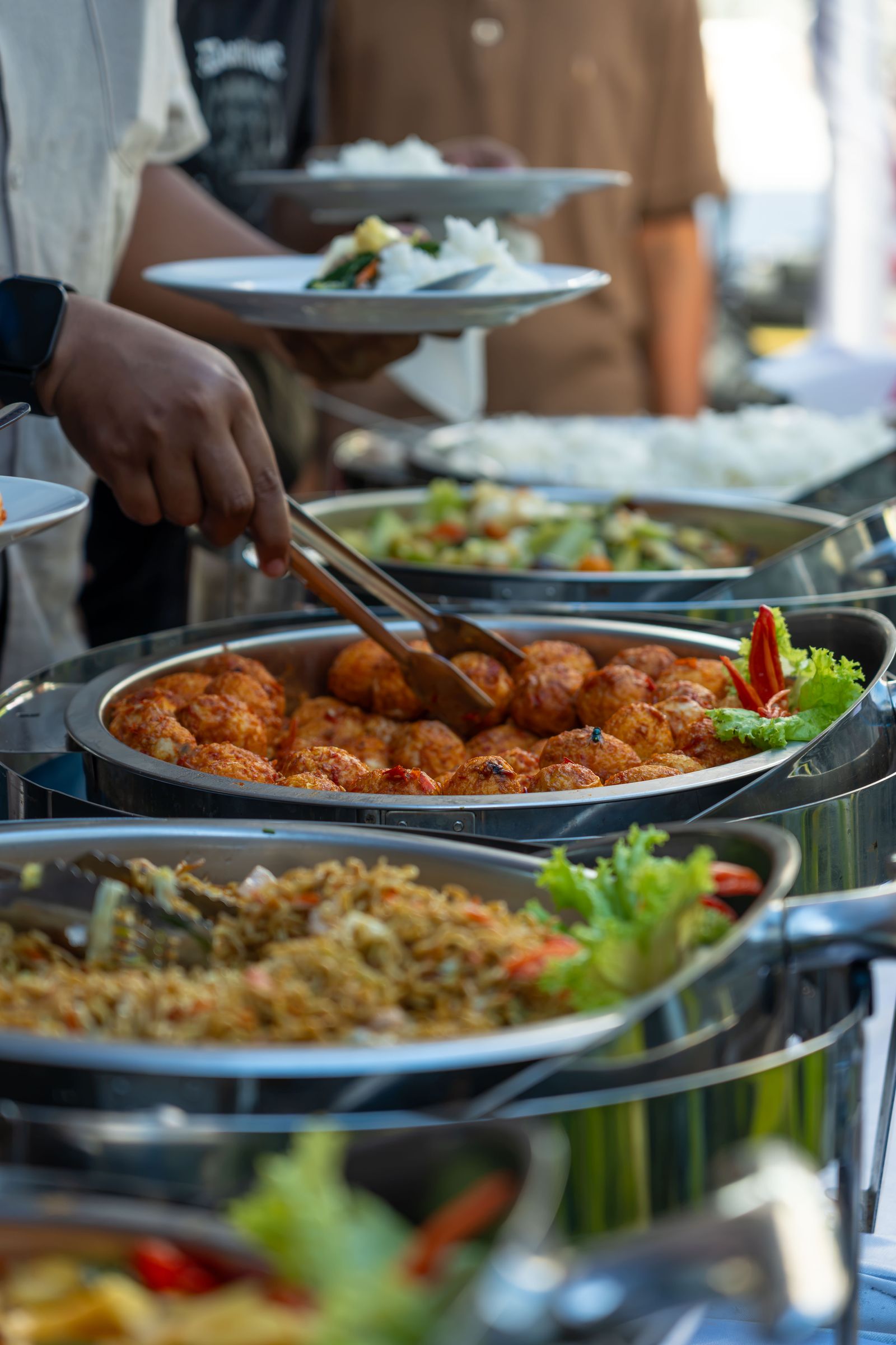 Buffet with diverse dishes at outdoor event