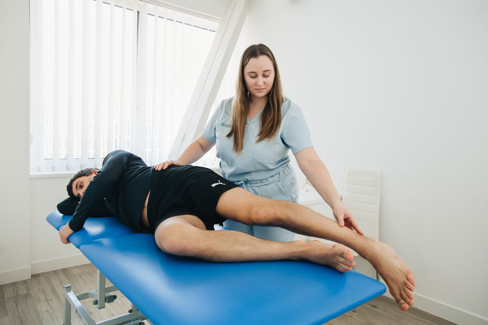 Chiropractor with patient in clinic