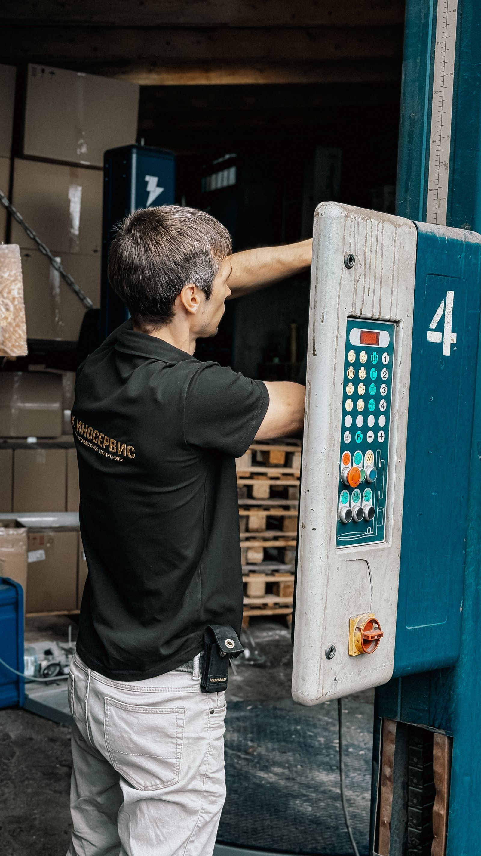 Warehouse worker operating loading dock panel