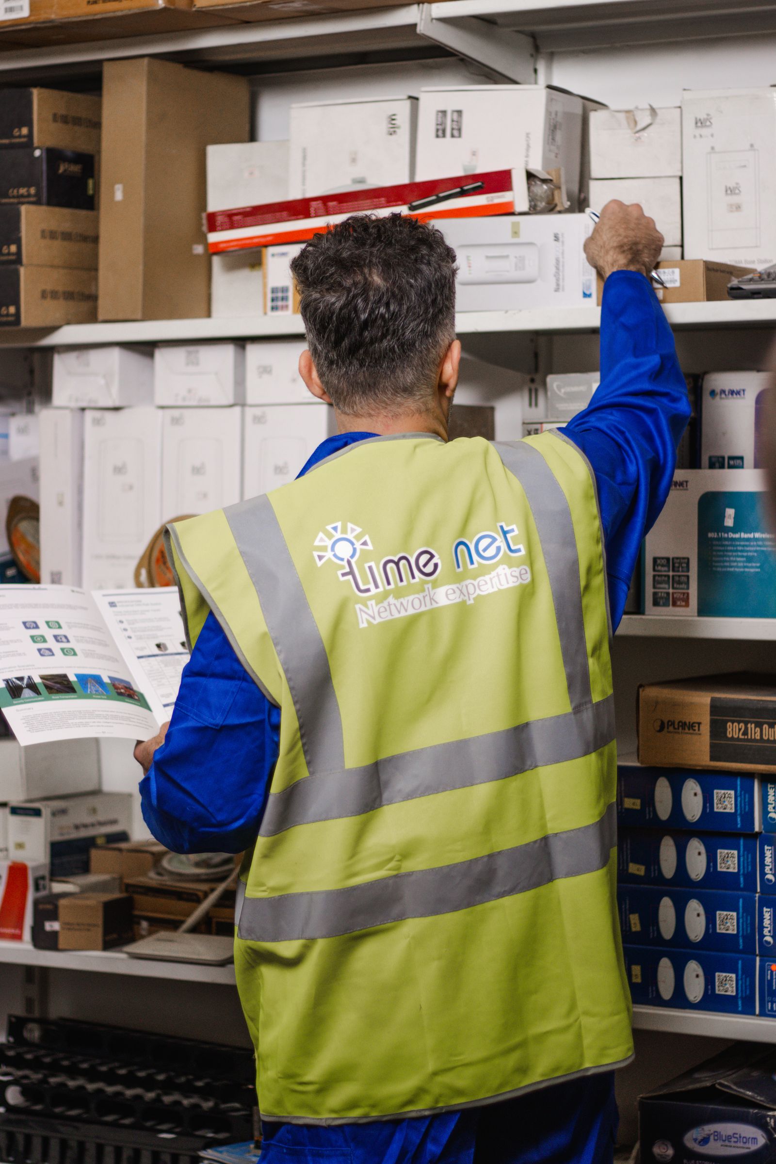 Man in reflective vest in warehouse