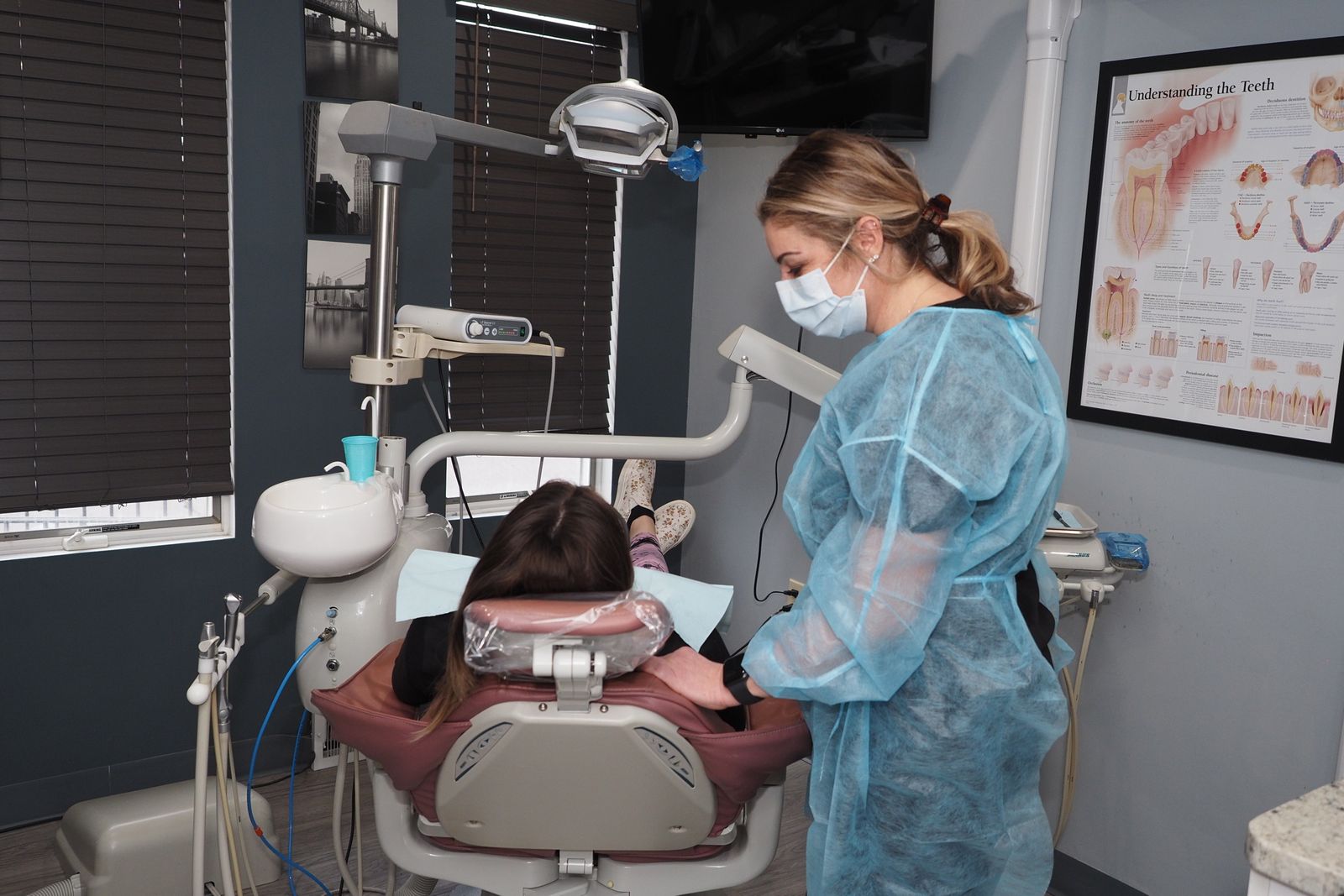 Dentist examining patient in dental office