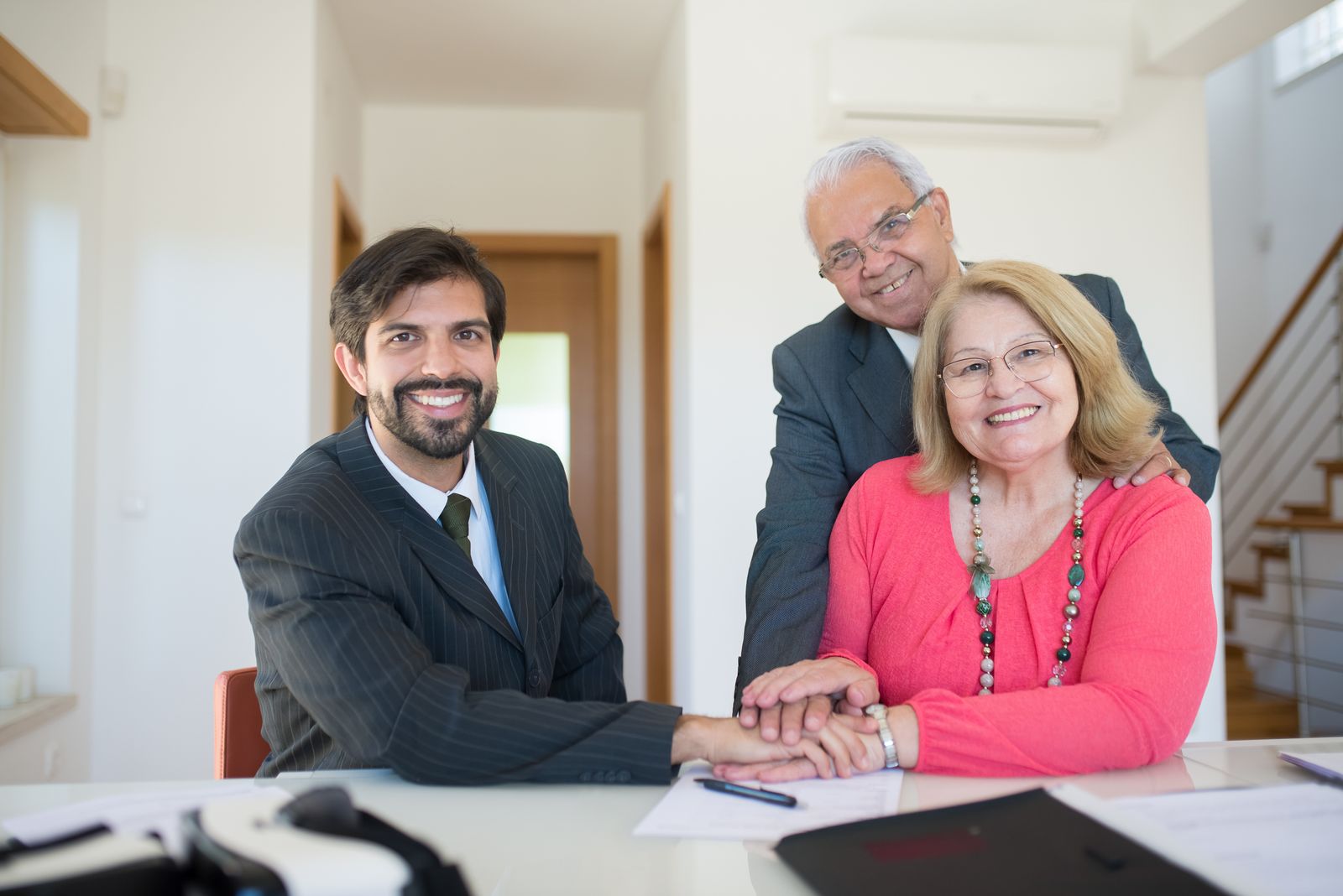 Financial advisor meeting couple at table