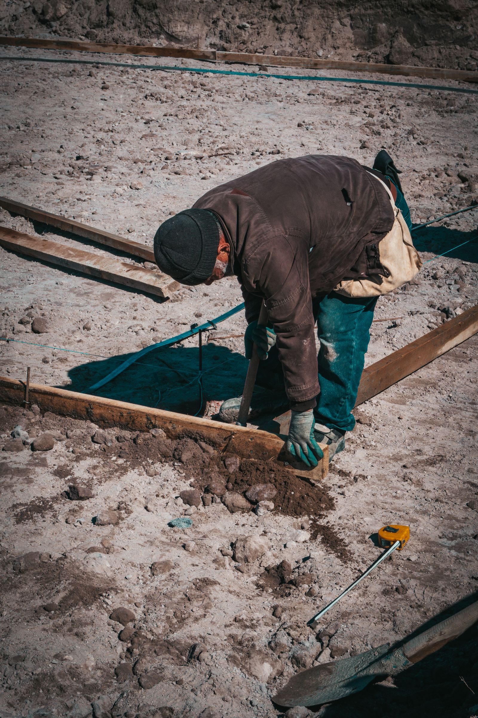 A construction worker engaged in groundwork preparation at a site in Türkiye