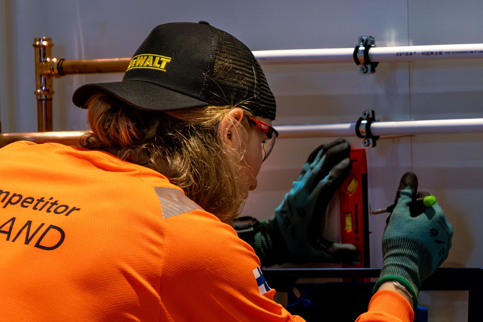 Skilled worker adjusting pipes with precision