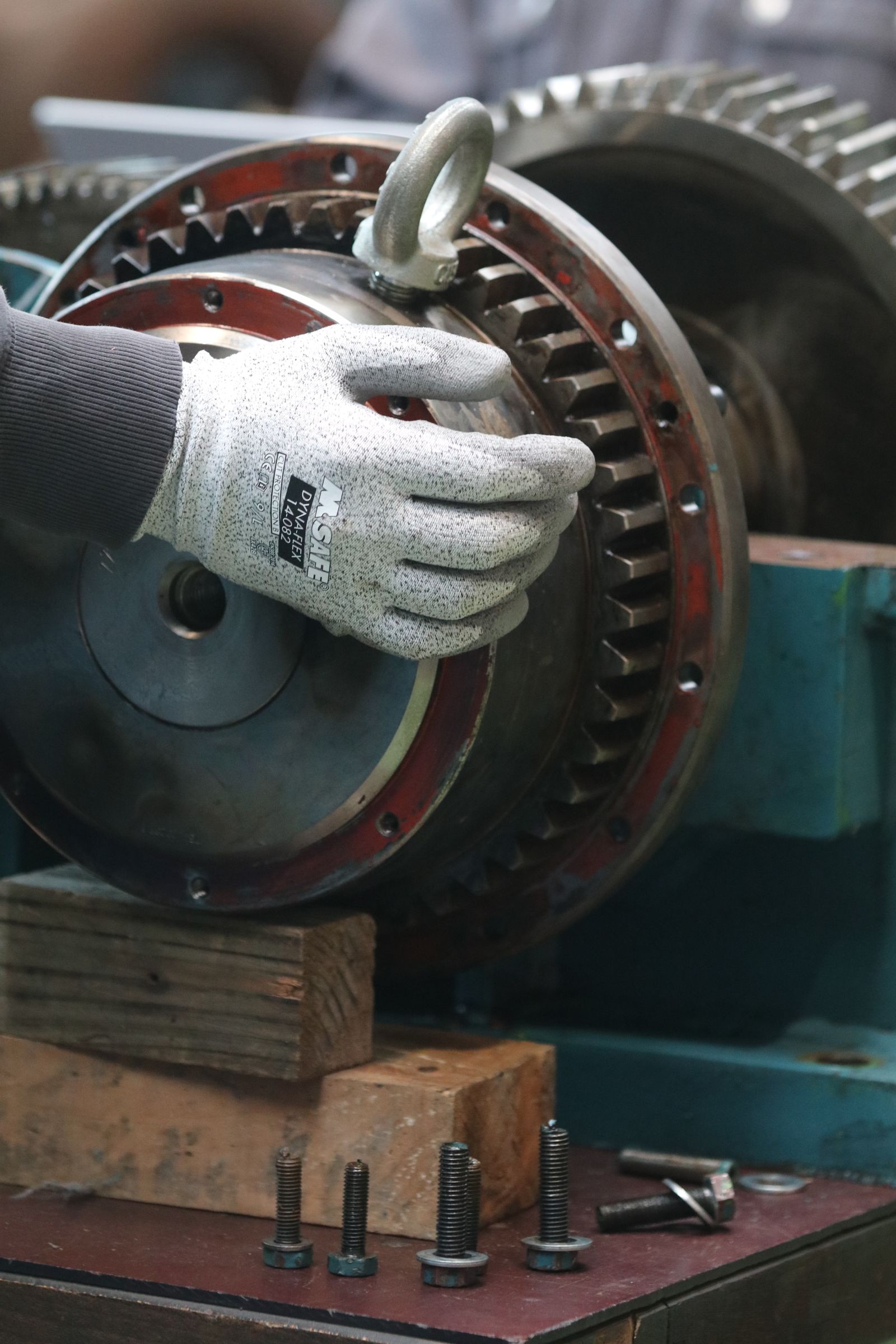 Person hand on industrial machinery