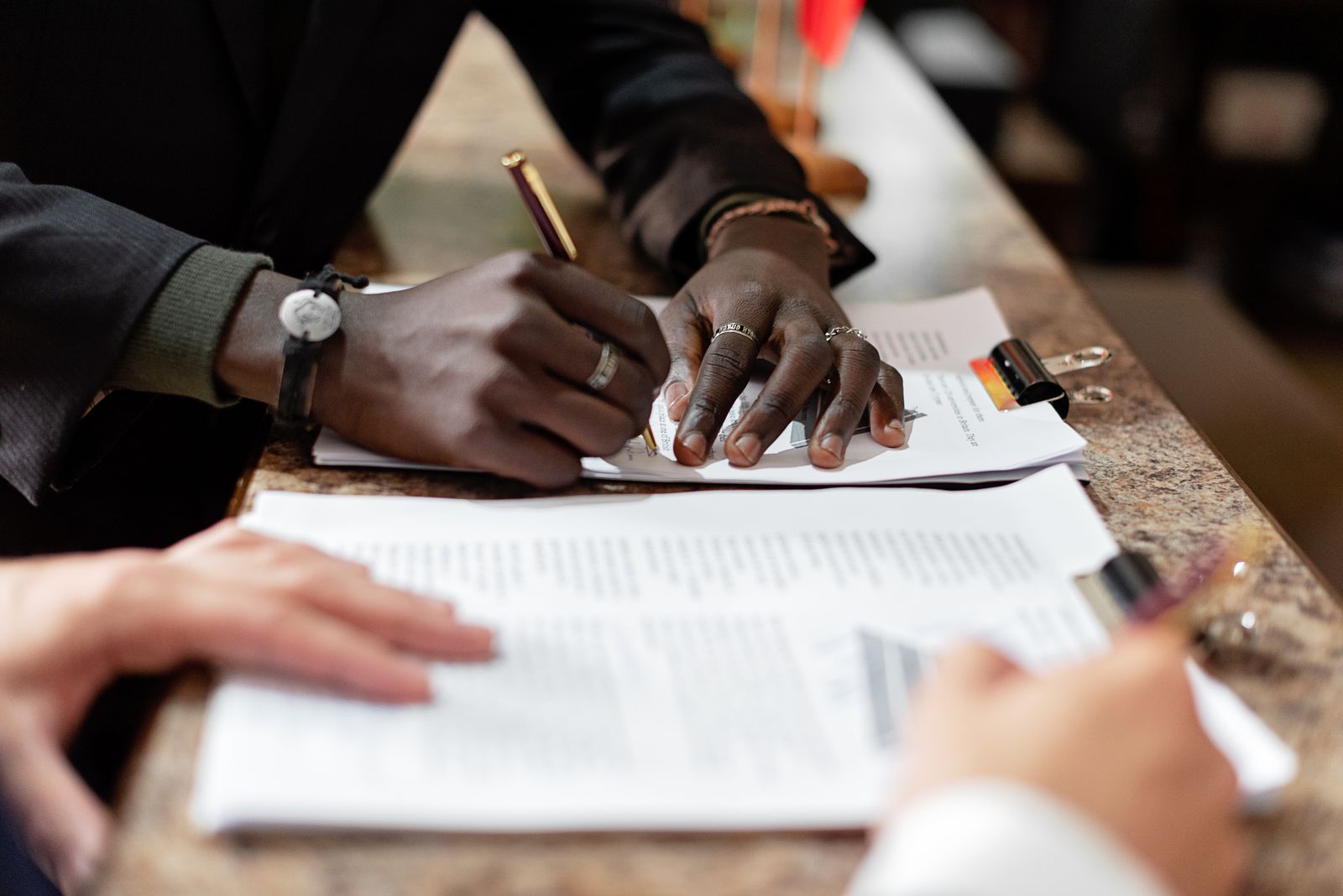 Notary signing documents with client