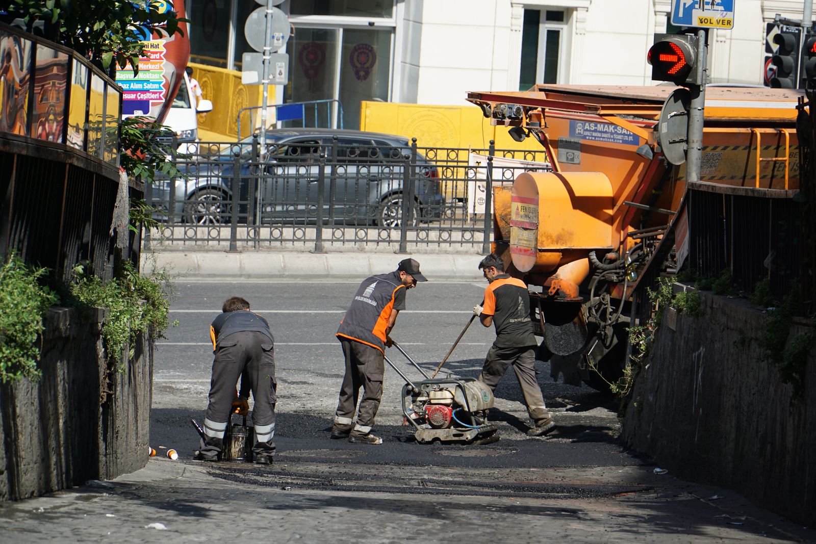 Road maintenance workers in istanbul street scene