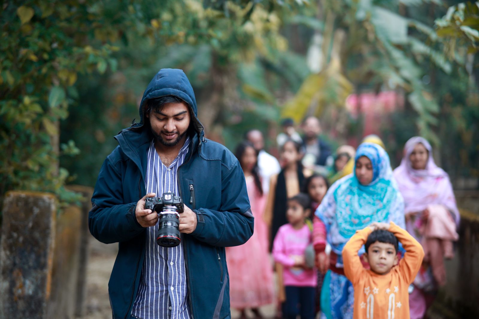 Man photographing in outdoor family gathering