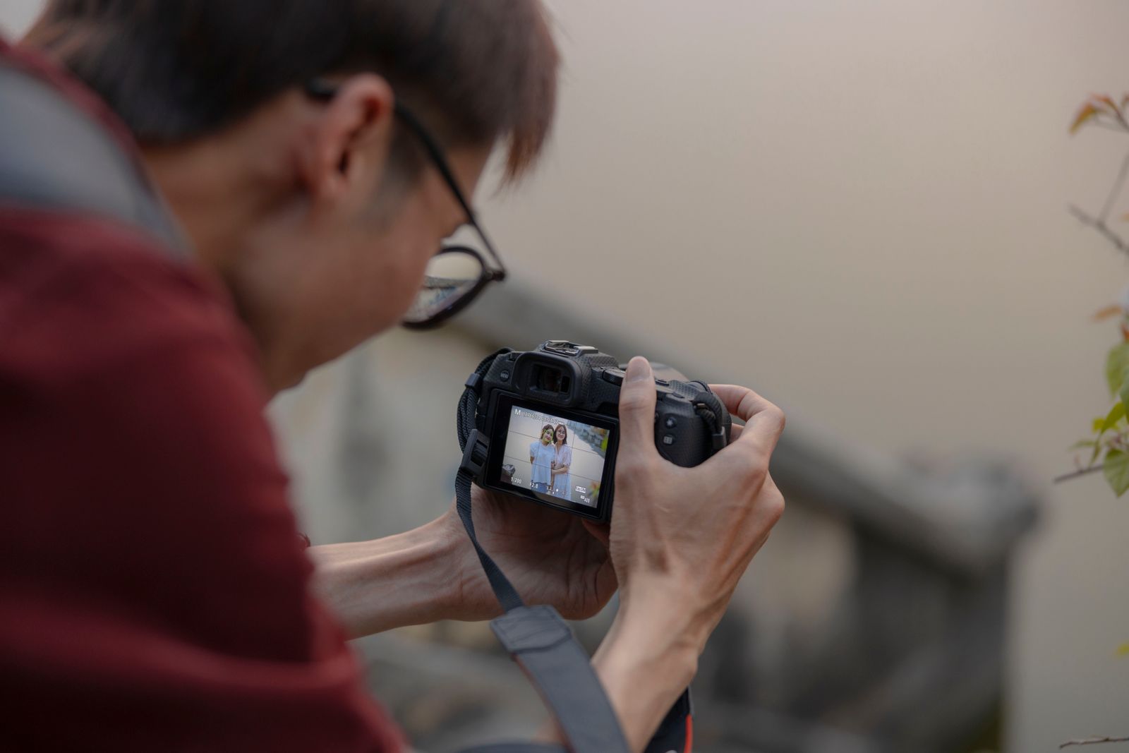 Man photographing with digital camera