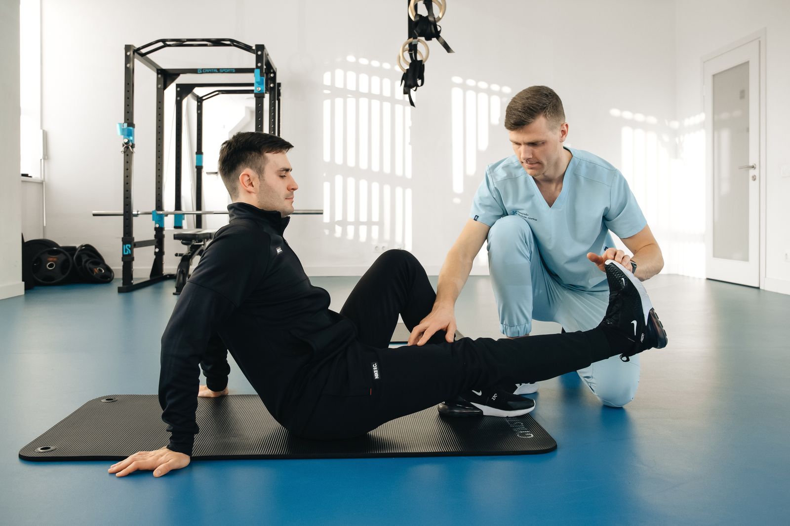 Patient exercising under care of therapist