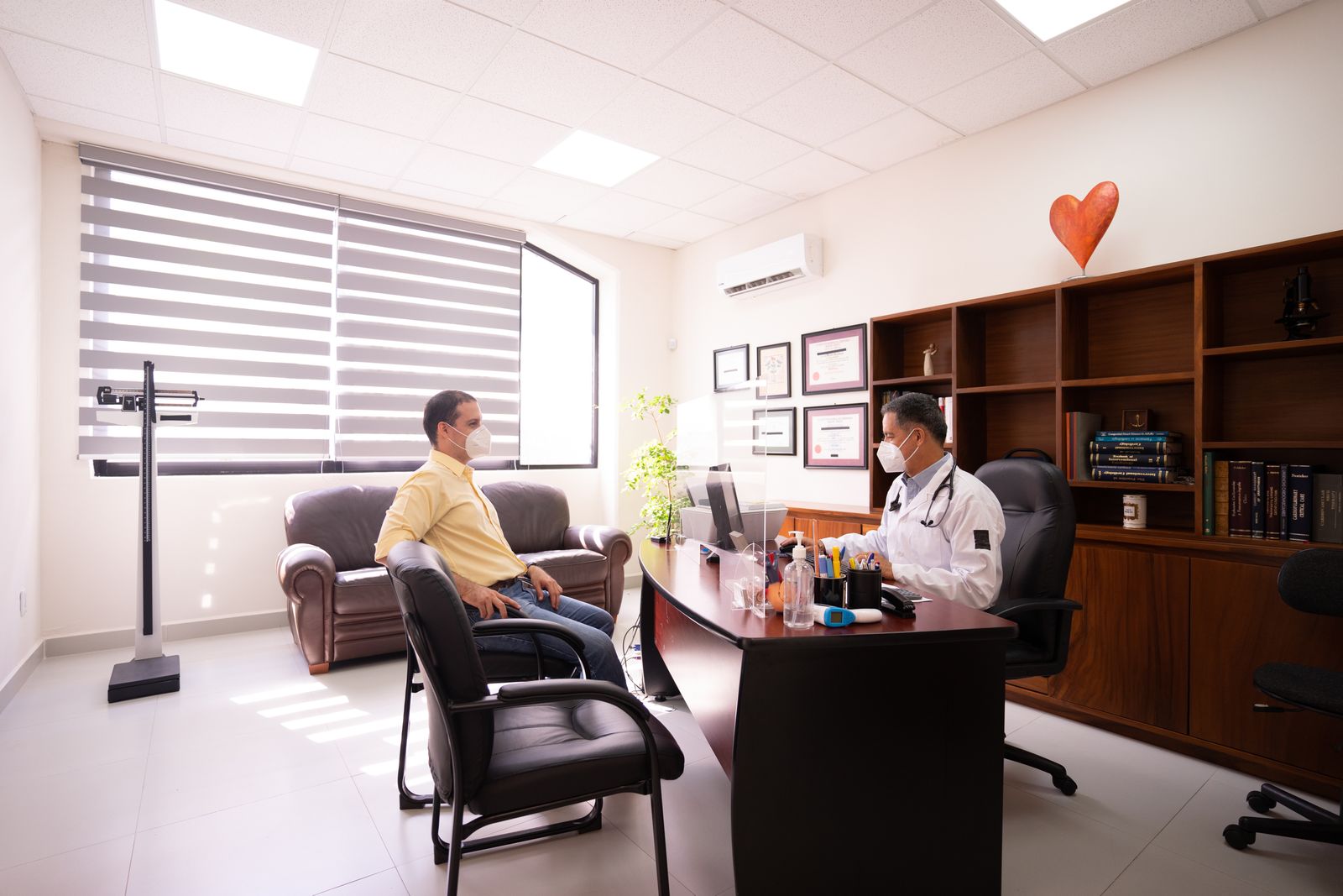 Doctor talking with patient in clinic
