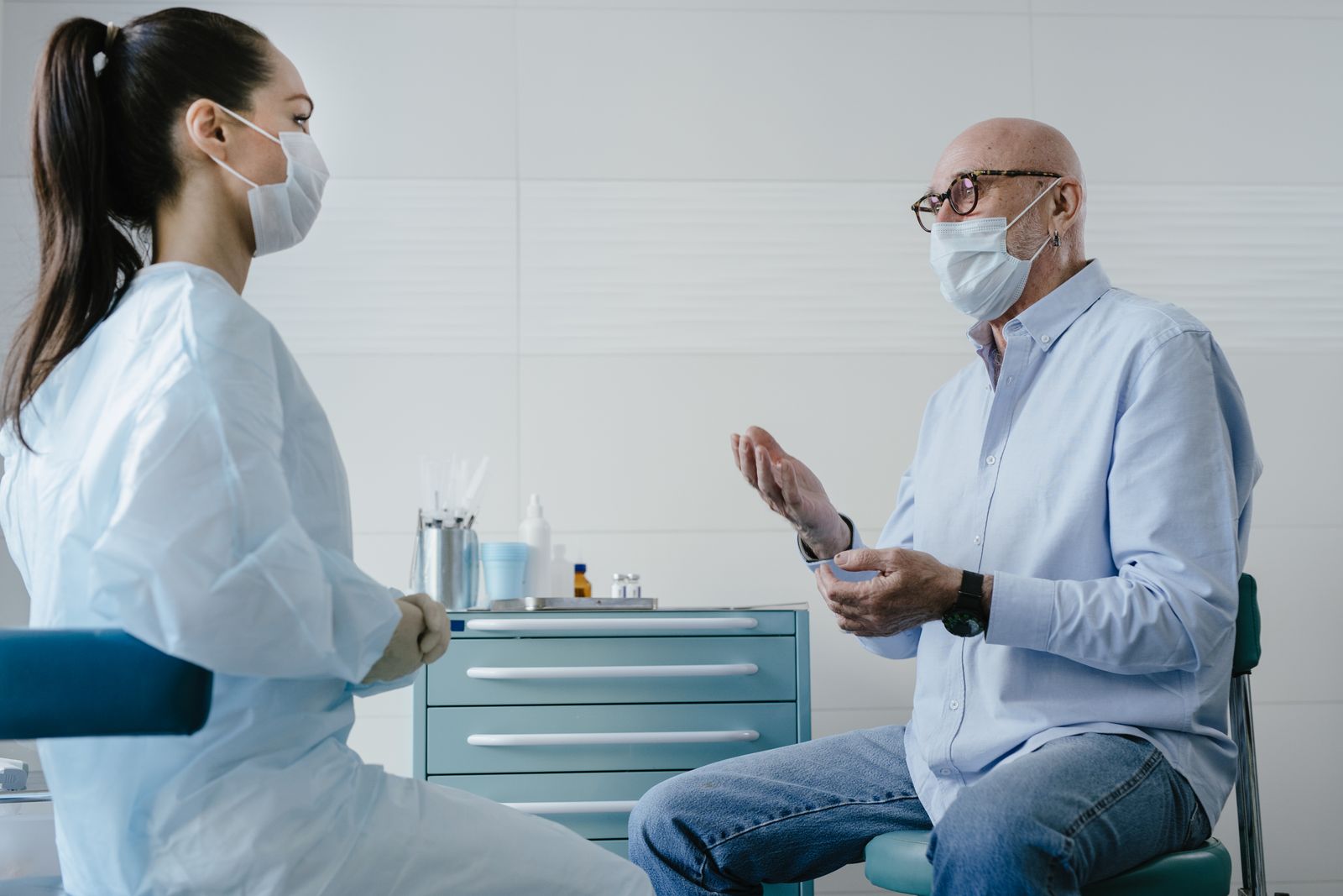 Doctor talking with patient in clinic