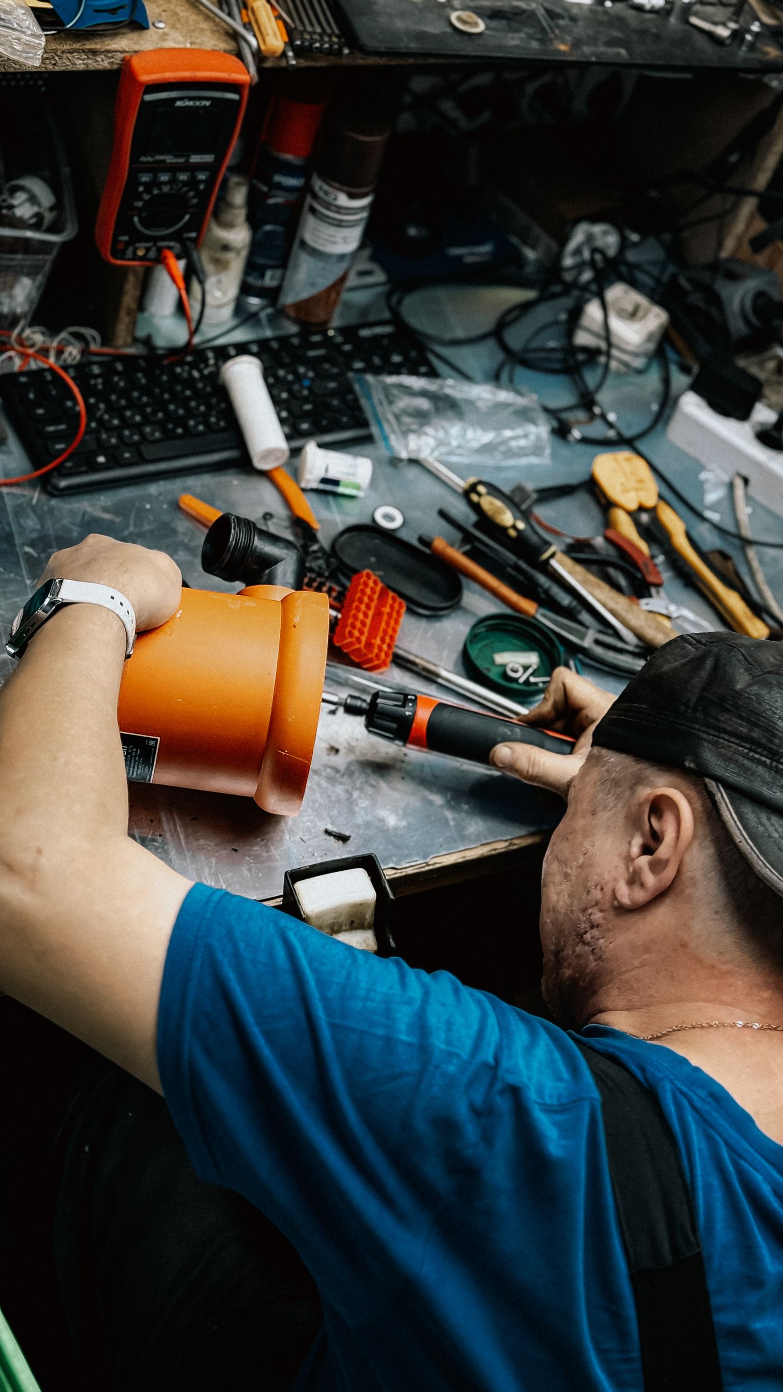 Technician repairing equipment in workshop