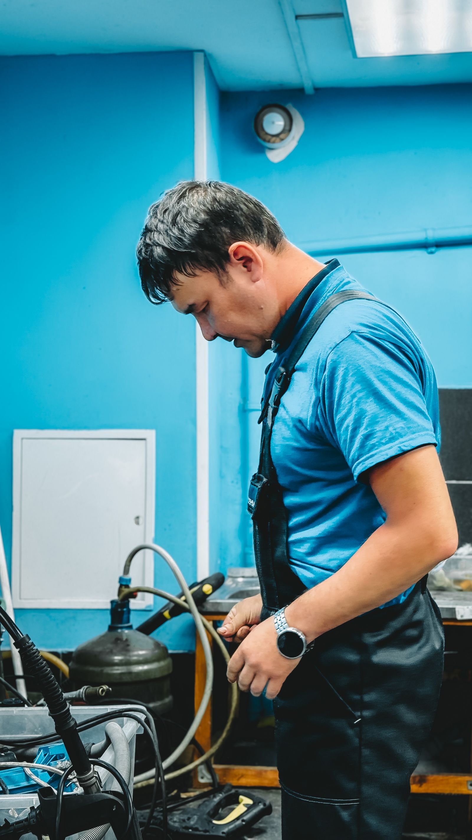 Male technician working in workshop setting
