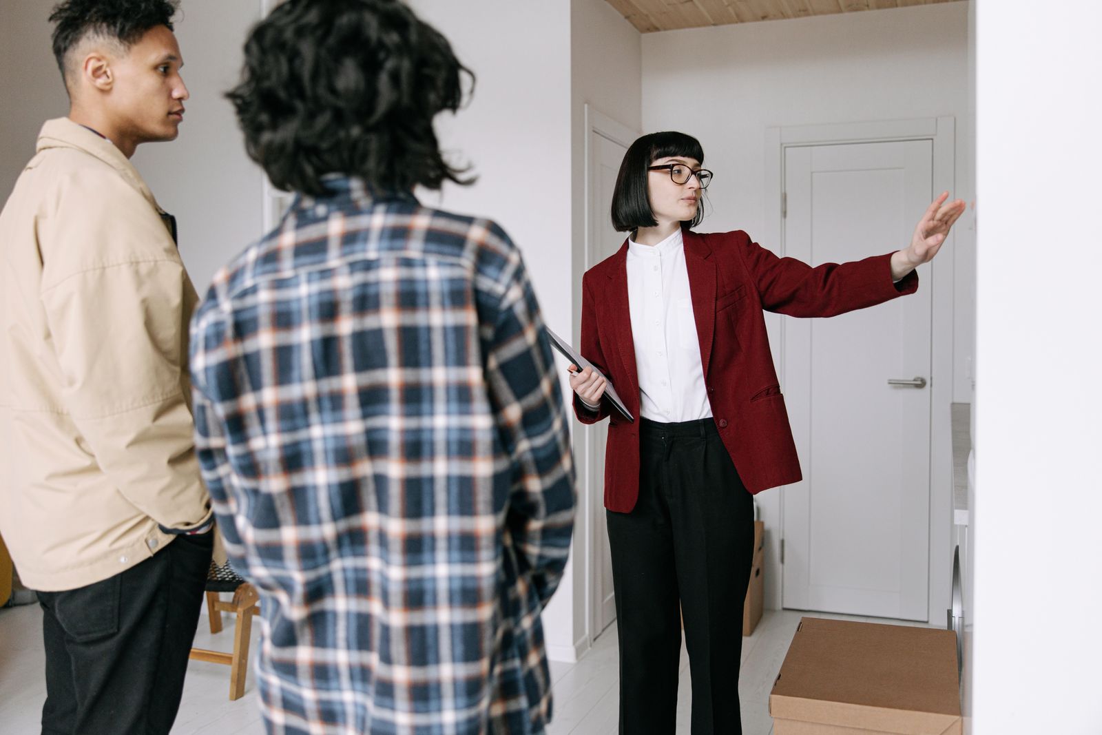 Real estate agent showing house to couple