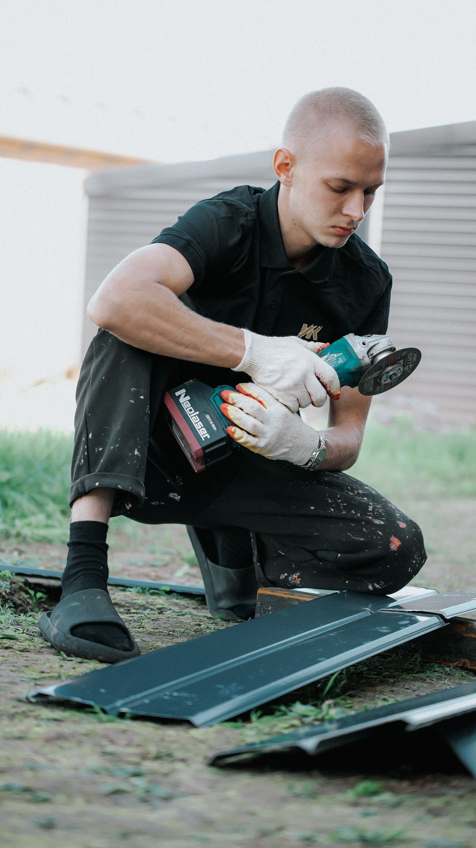 Construction worker installing roof siding