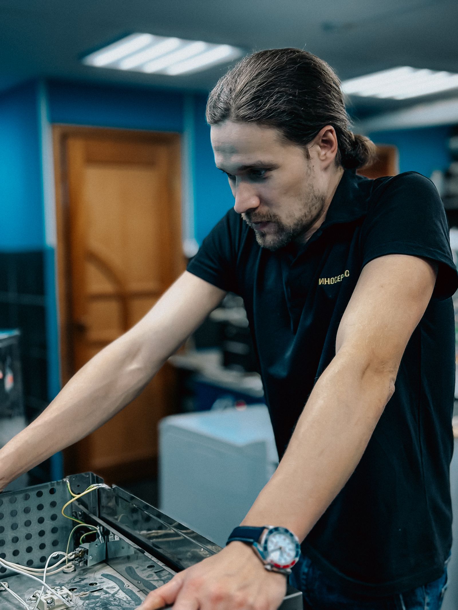 Focused technician working on computer hardware